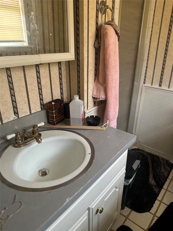 bathroom with vanity and tile patterned floors