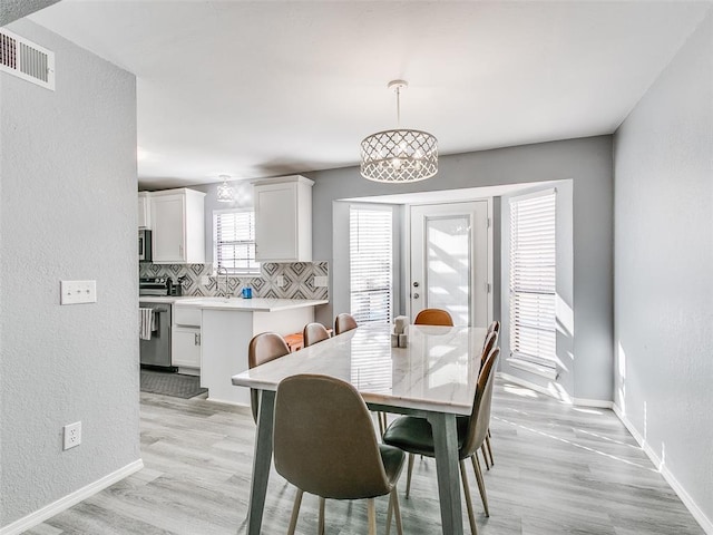 dining room with light hardwood / wood-style floors