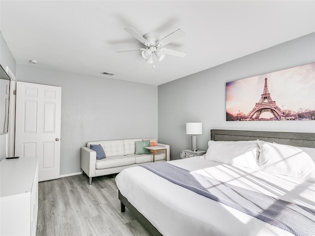 bedroom featuring ceiling fan and light hardwood / wood-style floors