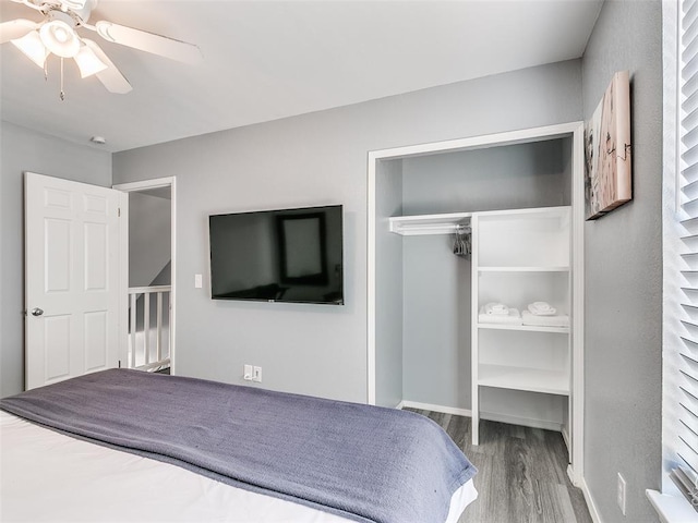 unfurnished bedroom featuring a closet, ceiling fan, and hardwood / wood-style flooring