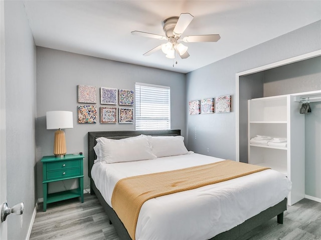 bedroom with hardwood / wood-style flooring and ceiling fan