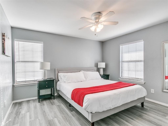 bedroom featuring ceiling fan and light wood-type flooring