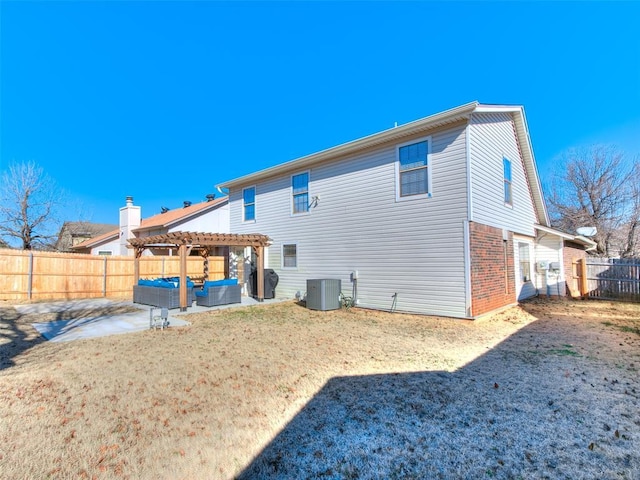 rear view of house with an outdoor living space, central AC, a pergola, a yard, and a patio area