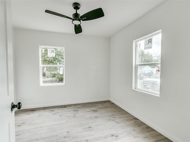 empty room featuring light hardwood / wood-style floors and ceiling fan