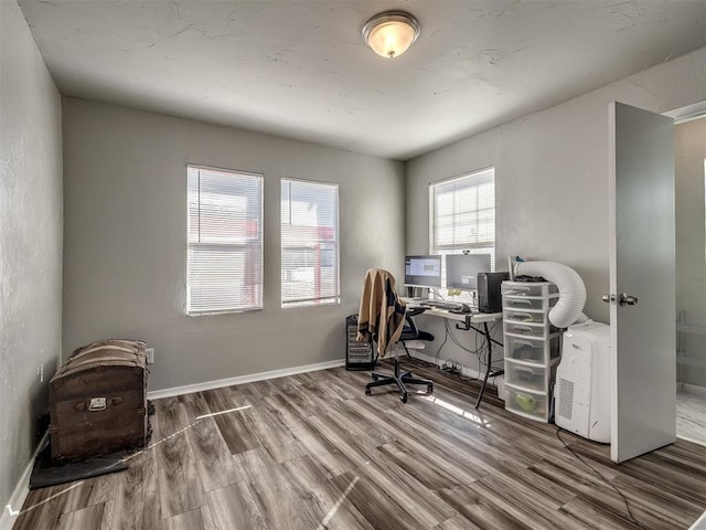 home office with hardwood / wood-style floors