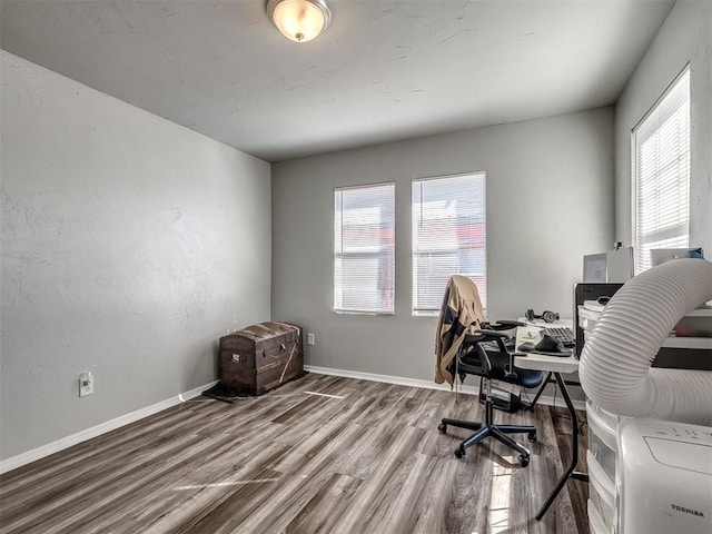 home office with hardwood / wood-style floors