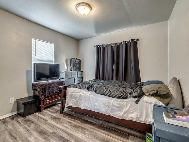 bedroom featuring hardwood / wood-style floors