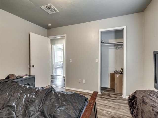 bedroom featuring a closet and light hardwood / wood-style flooring