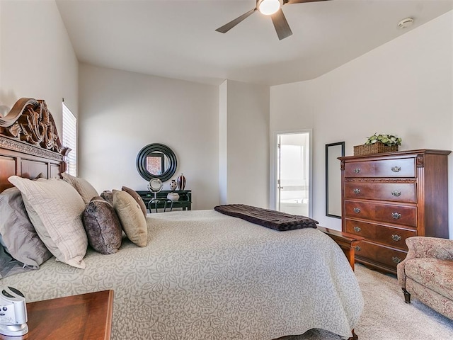 carpeted bedroom featuring ceiling fan and ensuite bathroom