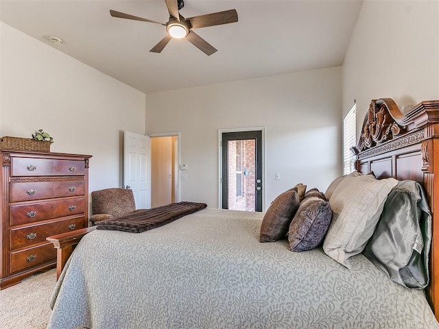 carpeted bedroom featuring ceiling fan and access to exterior