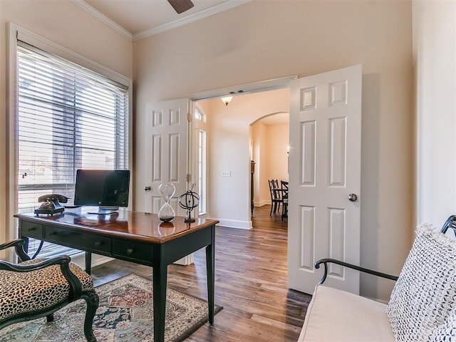 home office featuring wood-type flooring, ceiling fan, and ornamental molding