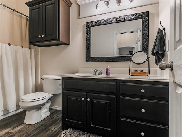 bathroom featuring hardwood / wood-style floors, toilet, and vanity