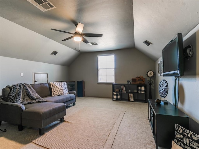 interior space with ceiling fan, light carpet, and lofted ceiling