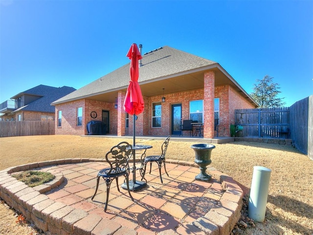 rear view of property with a patio area