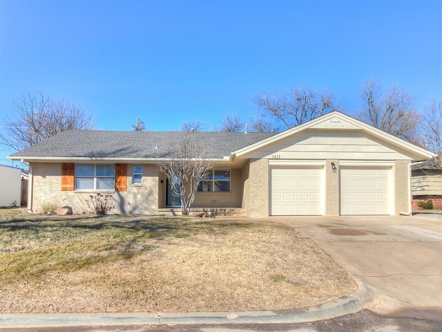 single story home with a garage and a front lawn