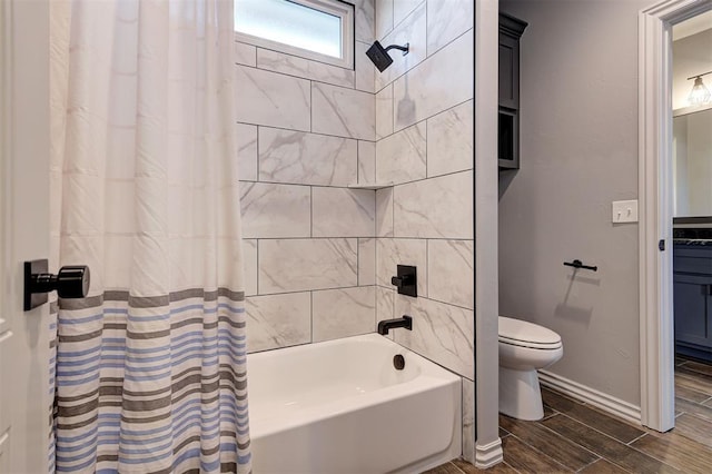 bathroom featuring toilet and shower / tub combo with curtain