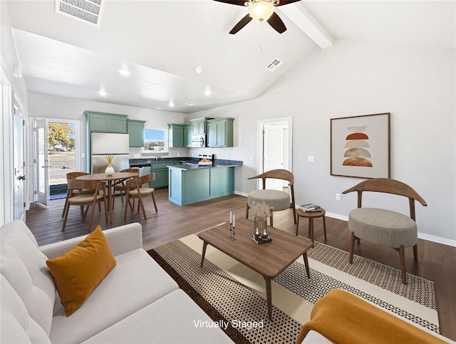 living room featuring ceiling fan, beamed ceiling, dark hardwood / wood-style floors, high vaulted ceiling, and sink