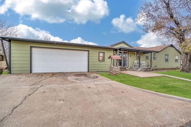 ranch-style house featuring a garage and a front yard