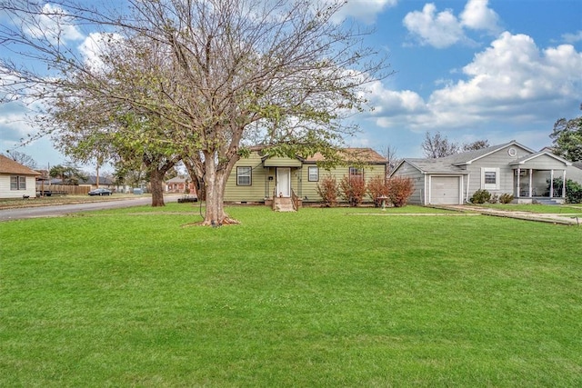 single story home with a garage and a front lawn