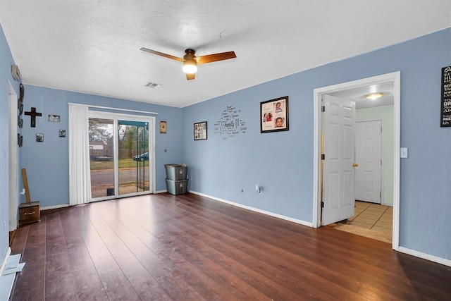 unfurnished room with hardwood / wood-style flooring and ceiling fan