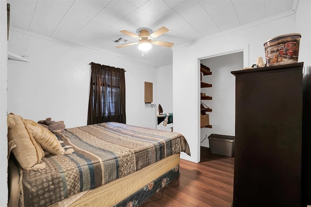 bedroom featuring crown molding, ceiling fan, and dark hardwood / wood-style flooring