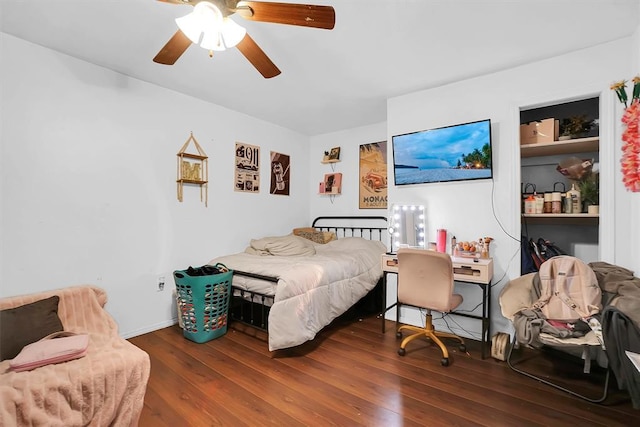 bedroom featuring dark wood-type flooring and ceiling fan