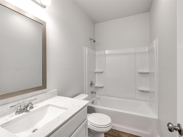 full bathroom with vanity,  shower combination, and toilet