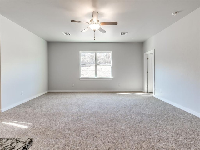 unfurnished room featuring ceiling fan and light carpet