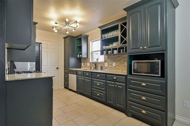 kitchen featuring light tile patterned floors, appliances with stainless steel finishes, light stone countertops, crown molding, and sink