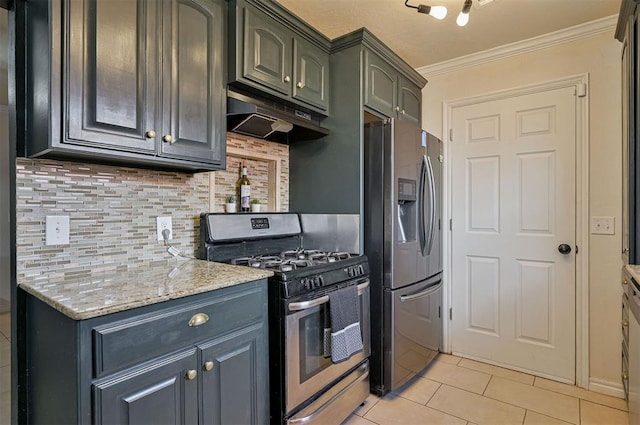 kitchen with appliances with stainless steel finishes, tasteful backsplash, light tile patterned flooring, ornamental molding, and light stone counters