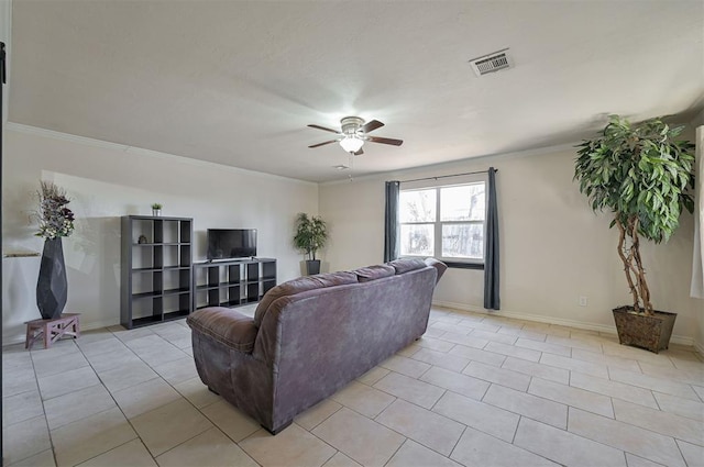 living room featuring ceiling fan, light tile patterned floors, and crown molding