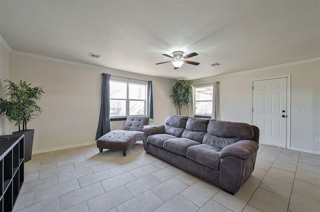 living room featuring ceiling fan, light tile patterned floors, and ornamental molding