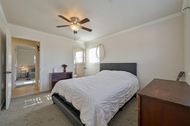 bedroom with ceiling fan, carpet floors, and ornamental molding