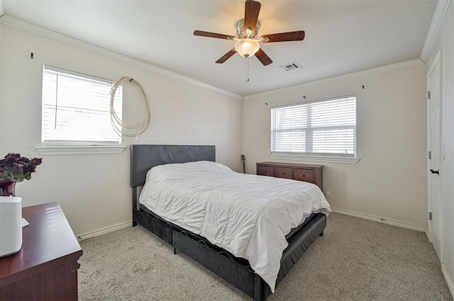 bedroom featuring ceiling fan, multiple windows, light carpet, and crown molding