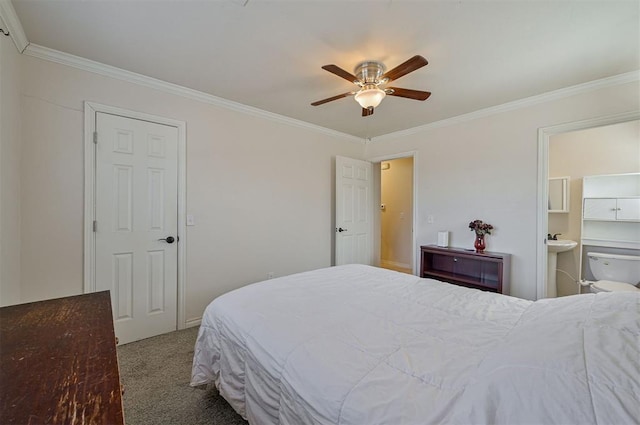 bedroom with ceiling fan, connected bathroom, carpet floors, and ornamental molding