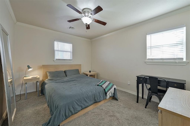 bedroom featuring ceiling fan, carpet floors, and ornamental molding