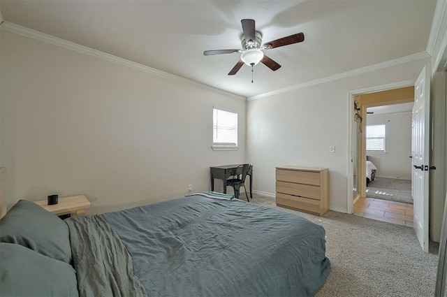 carpeted bedroom with ceiling fan and ornamental molding