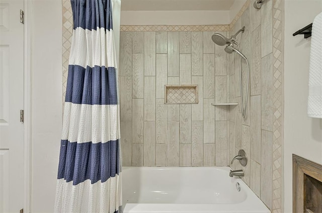 bathroom with shower / bath combo with shower curtain