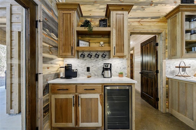 bar featuring wooden walls, decorative backsplash, concrete flooring, and wine cooler