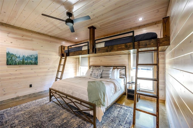 bedroom featuring wood ceiling and wood walls