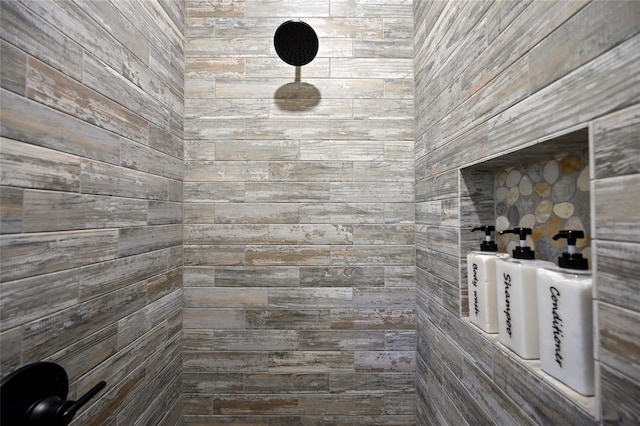 bathroom with tiled shower