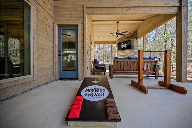 view of patio featuring ceiling fan