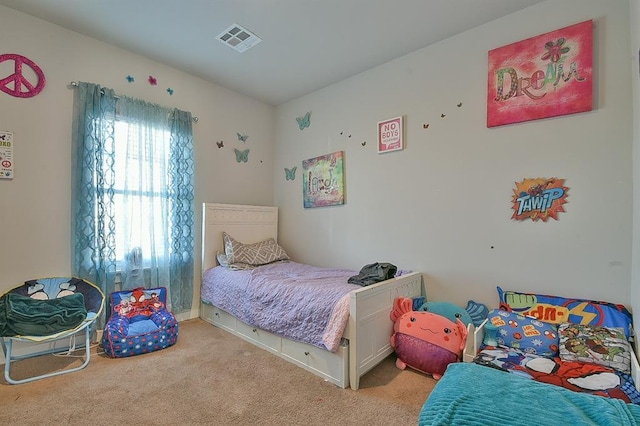 bedroom featuring light colored carpet