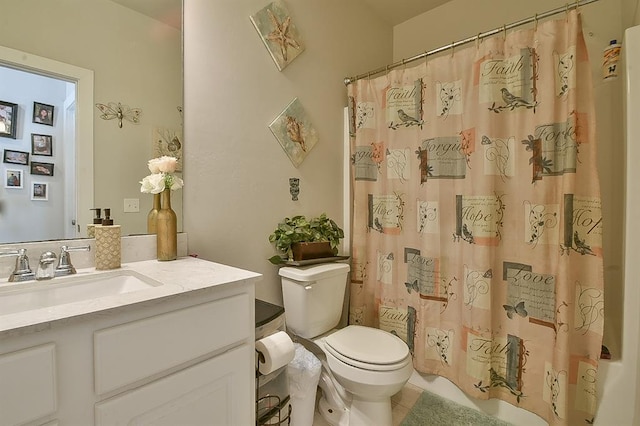 bathroom featuring vanity, toilet, and walk in shower