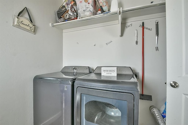 washroom featuring washer and clothes dryer