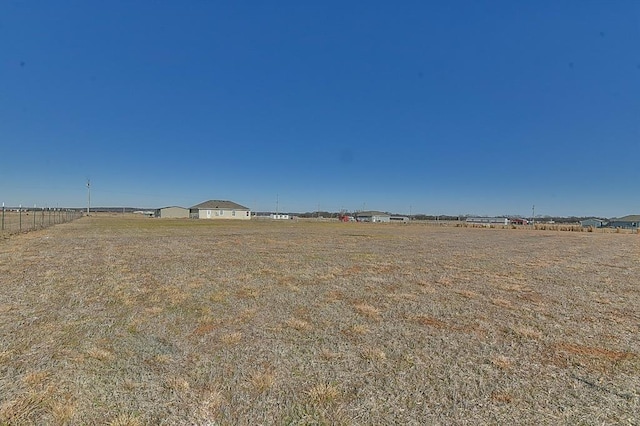 view of yard with a rural view