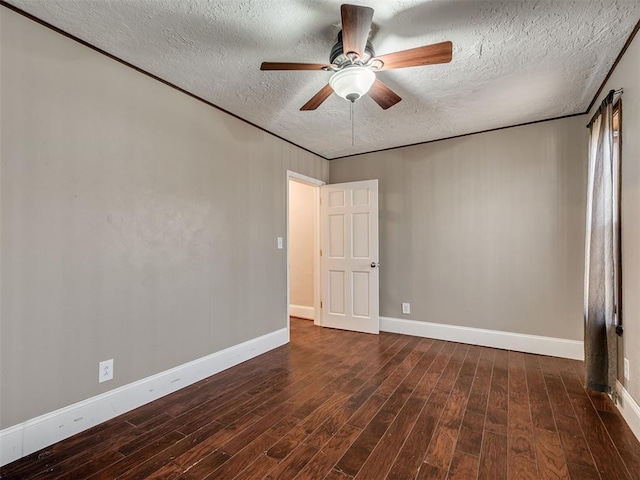 spare room featuring ceiling fan, dark hardwood / wood-style floors, and a textured ceiling