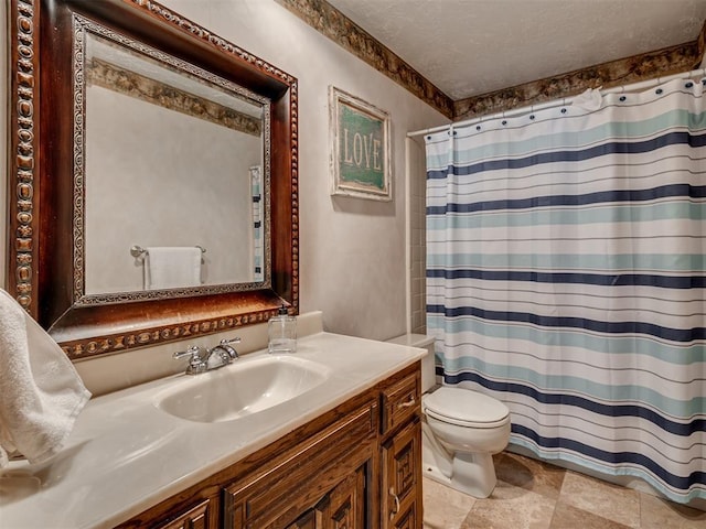 bathroom featuring vanity, curtained shower, a textured ceiling, and toilet