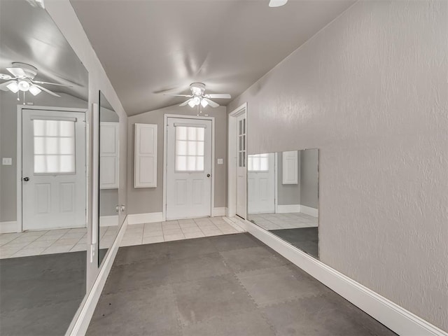 foyer with vaulted ceiling and ceiling fan