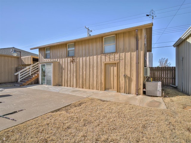 back of house featuring central AC and a patio area